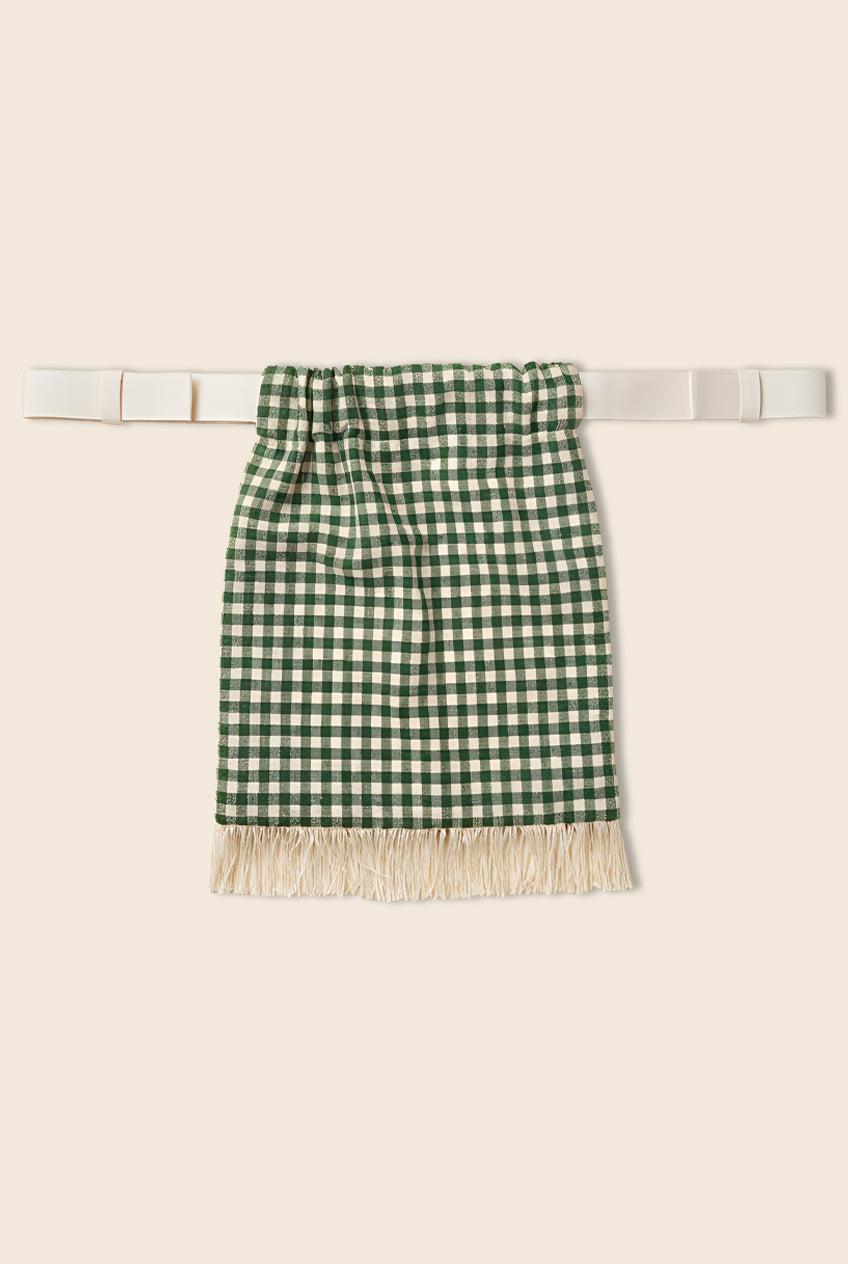 Green and white checkered pouch bag with fringe, featuring sheer polka dot lining on the inside. 