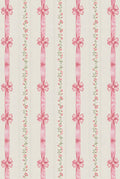 Pattern of pink ribbons and bows on a light cream background