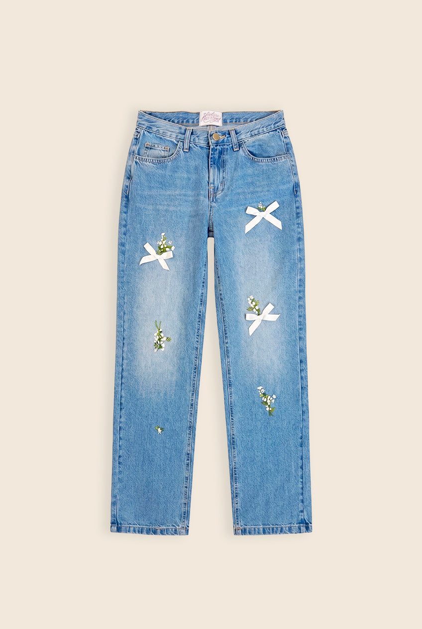 light wash blue jeans with hand embroidered flowers and bows