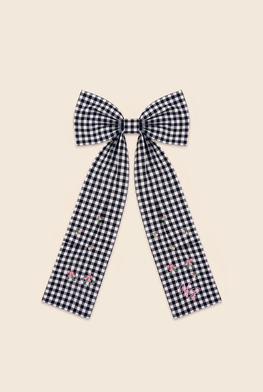 Navy blue and white checkered bow hair clip with embroidered flowers and VP logo