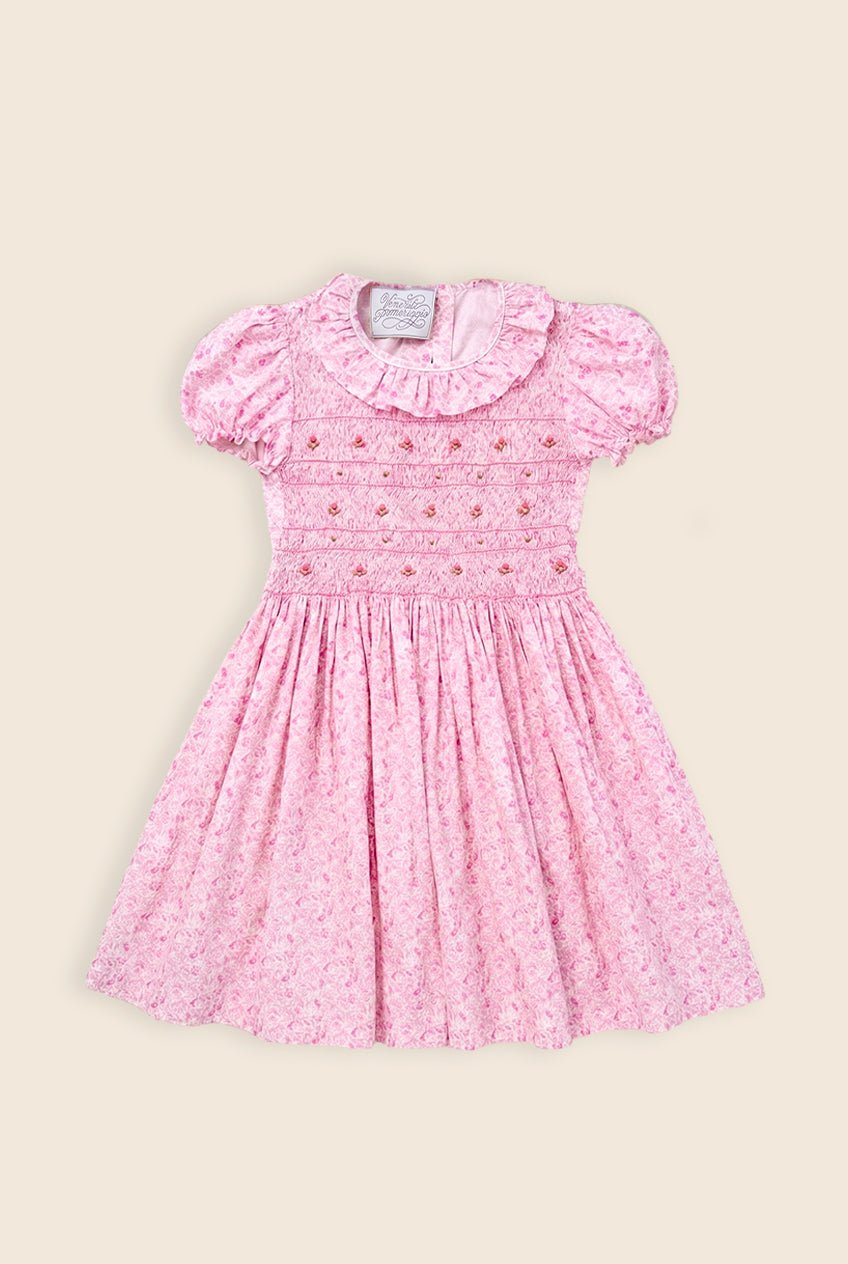 pink mini dress with floral print and smock detailing, complete with cap sleeves 