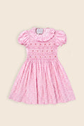 pink mini dress with floral print and smock detailing, complete with cap sleeves 