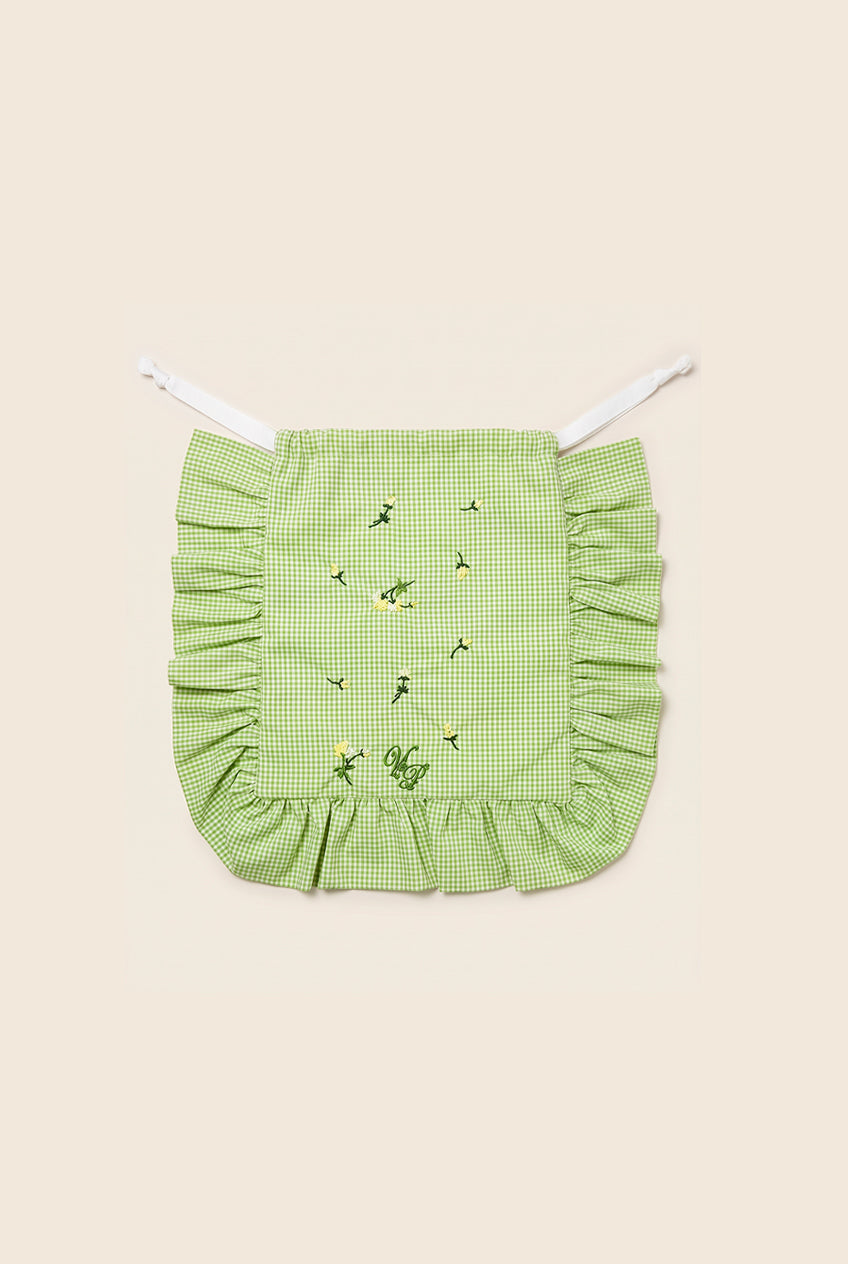 Green checkered purse with ruffled edges and embroidery details